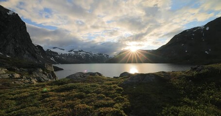 Wall Mural - Sunset against the backdrop of the Norwegian mountains. Beautiful Nature Norway natural landscape.