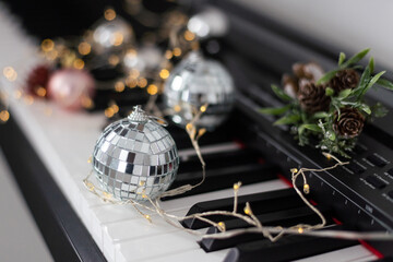 Wall Mural - Christmas ball on piano keys. Carol music concept