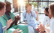 © Katsiaryna - Group of multi national doctors for discussing analysis in the conference room