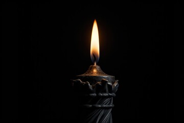 Poster - A single lit candle shining in the darkness. This image can be used to symbolize hope, inspiration, relaxation, or as a representation of a peaceful atmosphere.