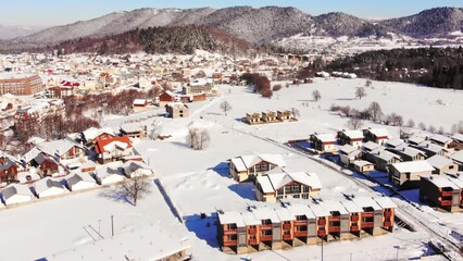 Wall Mural - Static aerial view of Bakuriani village, winter resort in Georgia. Scenic panorama from top ski resort viewpoint