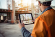 © Jasmina - Construction worker holding tablet in hands at a construction site
