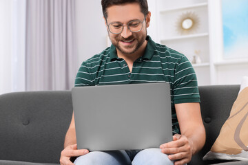 Sticker - Happy man having video chat via laptop at home