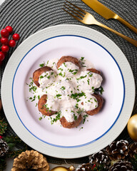 Poster - Pork meatballs with Greek tzatziki sauce with cucumber and yogurt. Christmas food on a table with decorations.