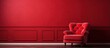 Detailed photo of an armchair by a wall in a crimson room