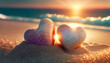 Two heart-shaped shells resting on the sand, sunset light