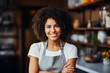 A cheerful young woman with a radiant smile and curly hair stands in a bright, welcoming kitchen wearing an apron, embodying the joy of home cooking and a healthy lifestyle