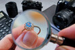 jeweler looking at ring with blue stone tourmaline paraiba, jewerly inspect and verify, pawnshop concept, jewerly shop, closeup