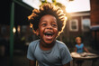 Black child laughing at loud, outdoors in school playground, sunlight in the hair, playing, wearing a tshirt, intense expression playful smile, african american boy, thrilled, classmate, happy, warm