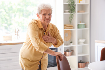 Sticker - Senior woman having heart attack in kitchen