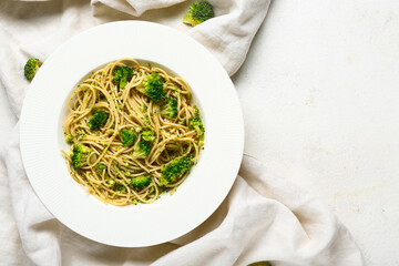 Wall Mural - Plate of tasty pasta with broccoli on white background