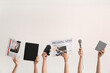 © Pixel-Shot - Female hands with newspapers, microphones and notebooks on light background