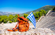 bag and Greek flag in Epidaurus amphitheater- Travel, vacation, tour tourism in Greece