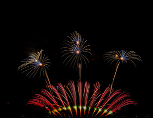 Fireworks show under defocus or blur concepts with isolated black background at night, this celebration is for the International Fireworks Festival in Pattaya on Nov 24-25 in Thailand