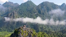 Aerial View Of Nam Xay Viewpoint In Vang Vieng, Laos With Light Clouds Floating Above. Dolly Right Shot