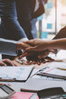 © Phimwilai - Business teamwork holding hands concept Business team joining hands Participate in business work with successful new startup projects.