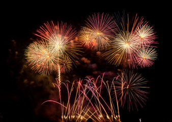 Fireworks show under defocus or blur concepts with isolated black background at night, this celebration is for the International Fireworks Festival in Pattaya on Nov 24-25 in Thailand