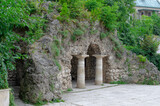 Fototapeta Do pokoju - antique columns.a stone cave.a stone grotto.a grotto with benches.