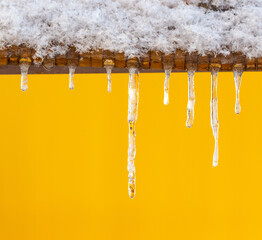 Canvas Print - Icicles on a yellow background