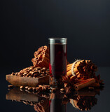 Fototapeta Na sufit - Coffee liquor with ingredients on the black reflective background.