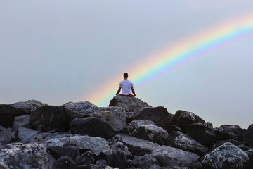 meditation on the rocks, silhouette of a person at sunset