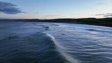 Surf's Up In Scotland: Aerial View Of Waves Off Thorntonloch Beach At Sunset, North Sea Coast, Dunbar, Scottish Coast Near Edinburgh, Scotland, United Kingdom