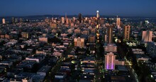 Hyperlapse drone shot backwards over the cityscape of San Francisco, sunset in USA