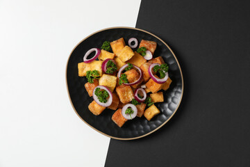 Wall Mural - Fried tofu in a bowl on a black and white background