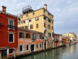 View of boats, canal and buildings. Selective focus