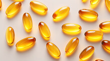 Transparent Yellow Vitamins On A Light Background. Vitamin D, Omega 3, Omega 6, Food Supplement Oil Filled Fish Oil, Vitamin A, Vitamin E 