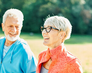 Wall Mural - woman senior man outdoor running couple lifestyle sport smiling together jogging healthy nature fit happy active retirement exercise fitness run