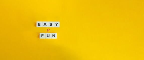 Wall Mural - easy and fun expression on block letter tiles on yellow background. minimalist aesthetics.