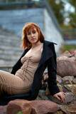 Fototapeta Młodzieżowe - Close-up Portrait of Stylish Redhead Woman in Urban Autumn Fashion
