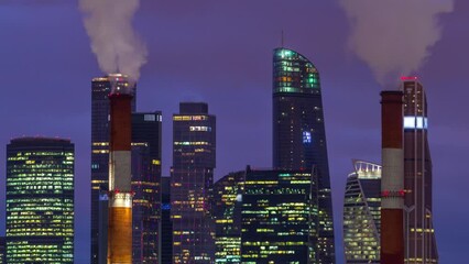 Poster - Day to night transition timelapse of Moscow City skyscrapers in winter with smoke from chimneys. Top view of International Business Center and commercial district after sunset in central Moscow