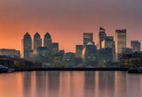 Fototapeta  - Morning Glow: Canary Wharf's Skyline Embraced by Dawn