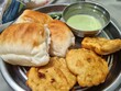 Delicious Vadapav breakfast meal on a plate, close-up and appetizing.