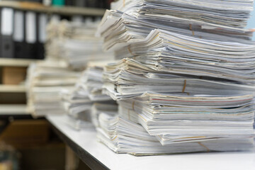 Wall Mural - Stack of old paper or documents on the table in office waits to management.