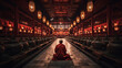 Buddhist monk in robes sitting in a temple. Concept of Spiritual Contemplation, Serenity, and Devotion in a Sacred Space.