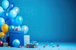 blue background with balloons and colorful party supplies in a blue gift box, in the style of shaped canvas