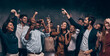 © gstockstudio - Happy young people toasting with champagne and dancing while enjoying celebration in night club