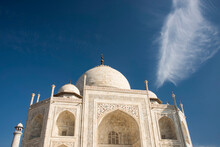 Opulent Beauty Of The Taj Mahal And View Of The Entrance Against A Bright Blue Sky; Agra, Uttar Pradesh, India
