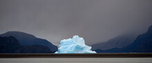 Large Iceberg Off The Glacier At Lago Grey Has Been Blown By The Wind Close To The Beach In Torres Del Paine National Park; Patagonia, Chile