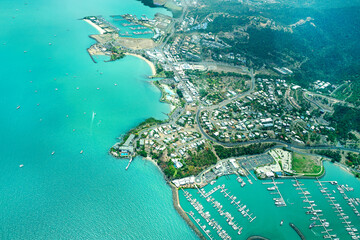 Poster - Aerial view of the Queensland Whitsundays City and Pionner Bay, near of the Great Barrier Reef, the world's largest coral reef system located in the Coral Sea, coast of Queensland, Australia. Dec 2019