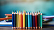 a row of colored pencils on a wooden desk. The pencils are various colors and the background is blurred, resembling a classroom or office setting, ai generative
