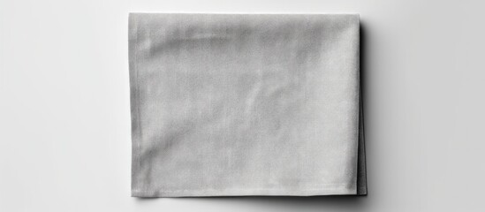 Leinwandbilder - Gray kitchen napkin isolated on table folded cloth for mockup on a flat lay Copy space image Place for adding text or design