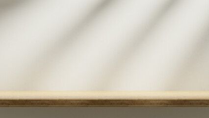 Fototapete - Wooden countertop on the white cream color plaster backdrop with sunlight beams and spotlights, empty advertising showroom for products and design, wooden table and tabletop mock up with empty place