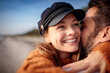 © Davor - Close up smiling young woman in embrace of her loving husband at the beach