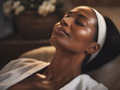 Beautiful mature black woman receiving facial treatment.