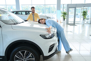 Wall Mural - Photo of beautiful female in car showroom