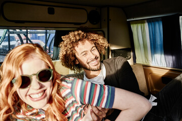 Poster - Happy young couple in a van